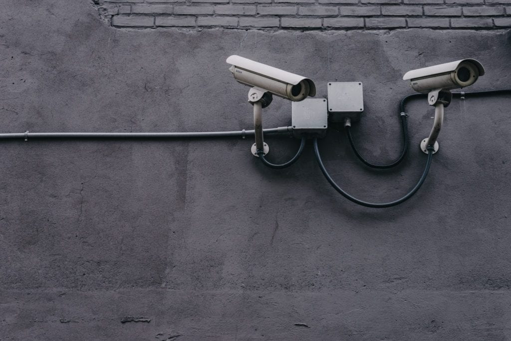 Security cameras on a gray wall